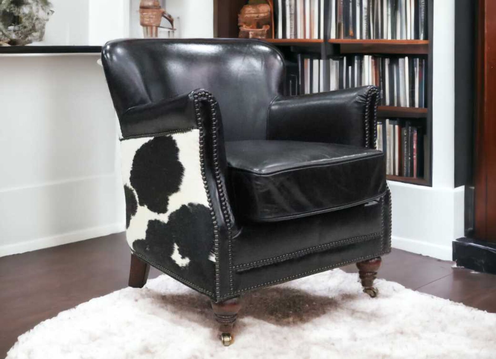 Product photograph of Black Cow Vintage Distressed Leather Armchair Designer Sofas4u Ex Display from Designer Sofas 4U
