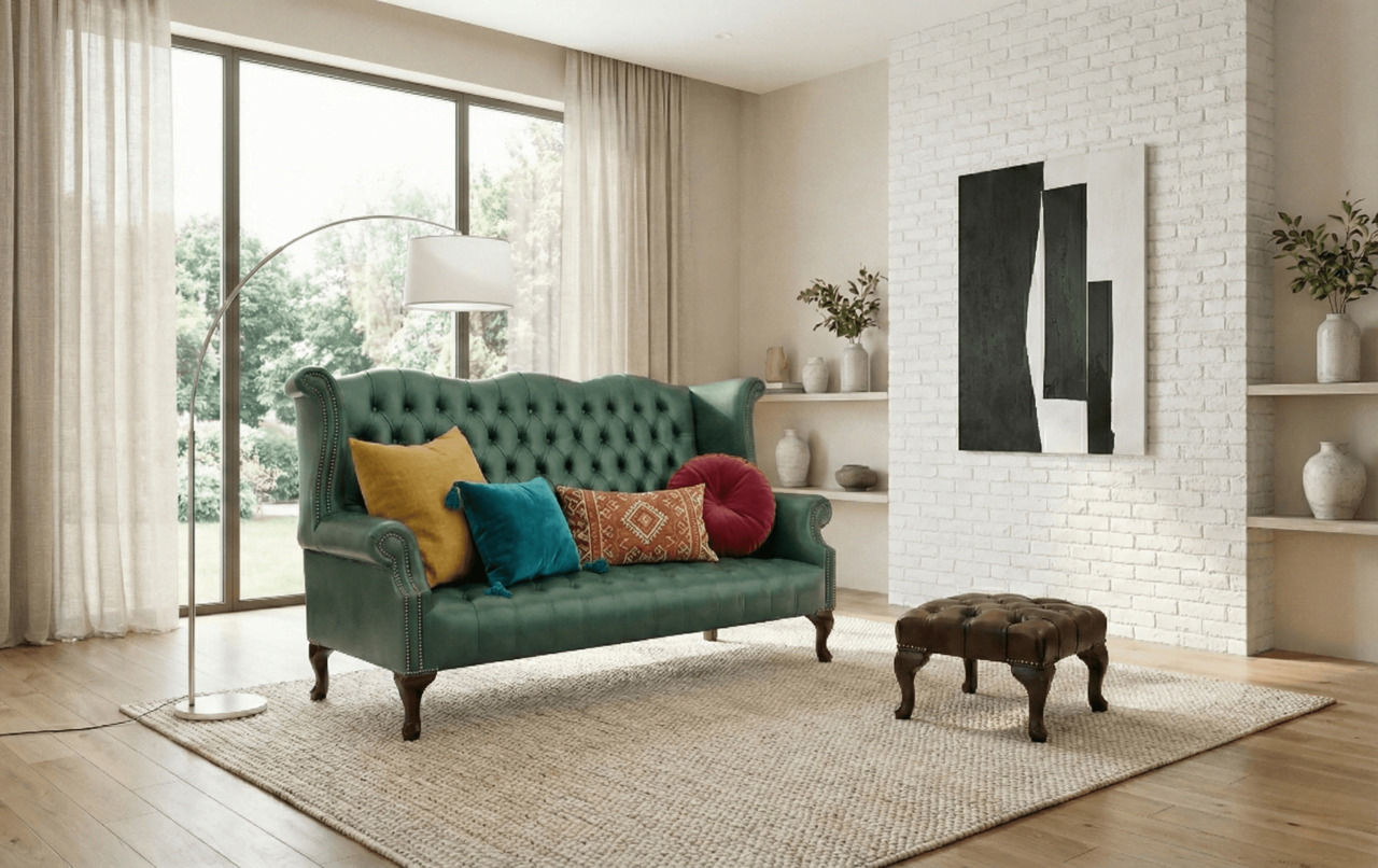 Modern living room featuring a tall-back green Chesterfield sofa with colourful cushions