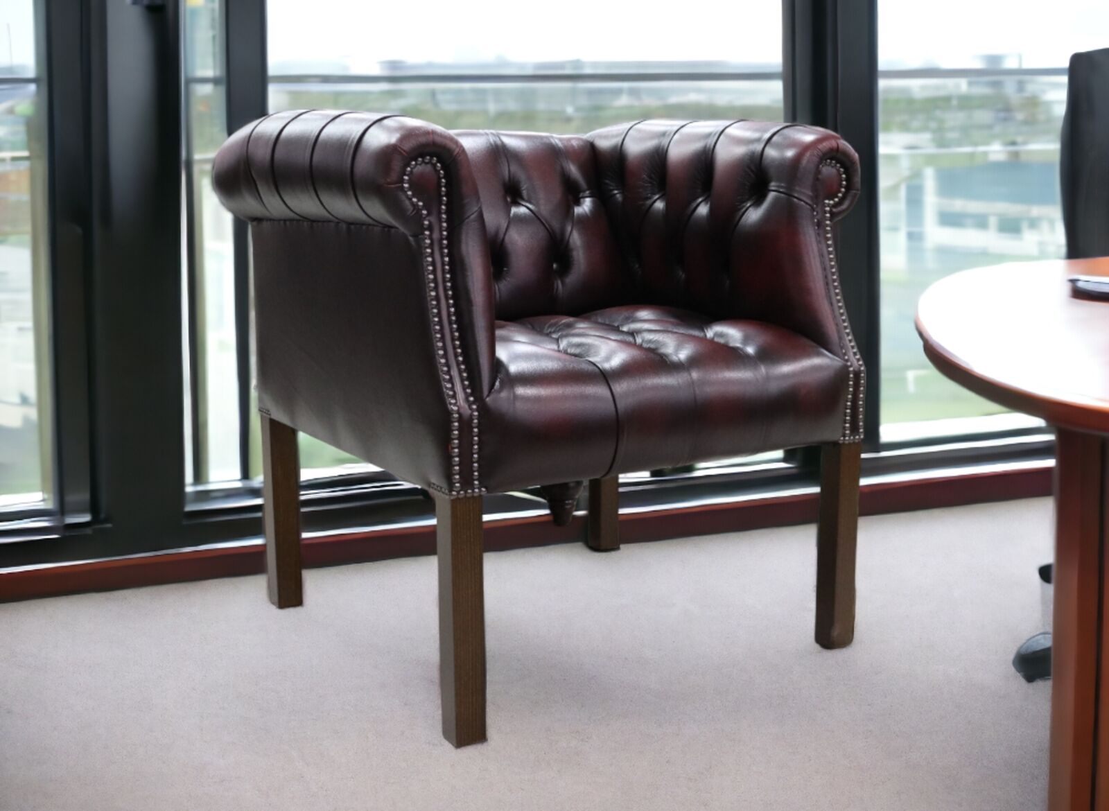Product photograph of Chesterfield Devon Tub Chair Buttoned Seat Antique Oxblood Leather from Designer Sofas 4U