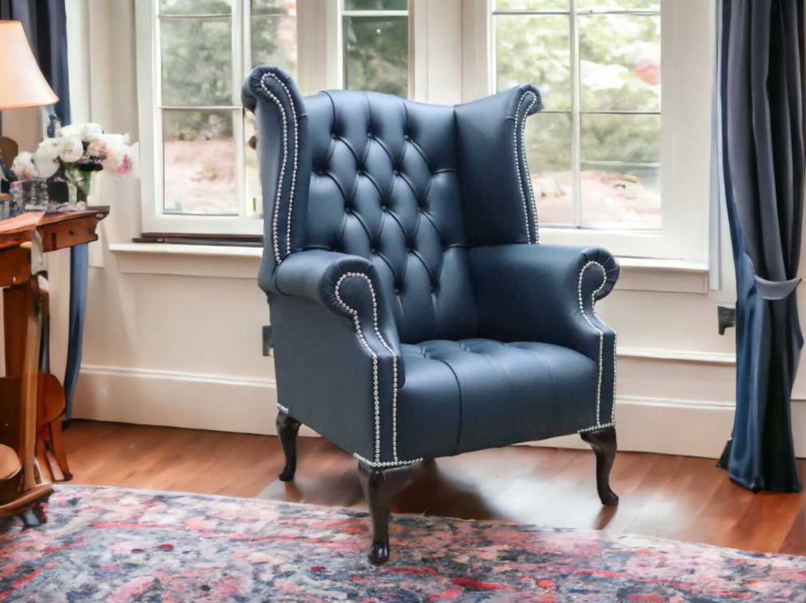 Product photograph of Chesterfield Buttoned Queen Anne High Back Wing Chair Suffolk Blue Leather from Designer Sofas 4U