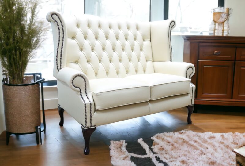 Product photograph of Chesterfield 2 Seater Queen Anne High Back Wing Sofa Cream Leather from Designer Sofas 4U
