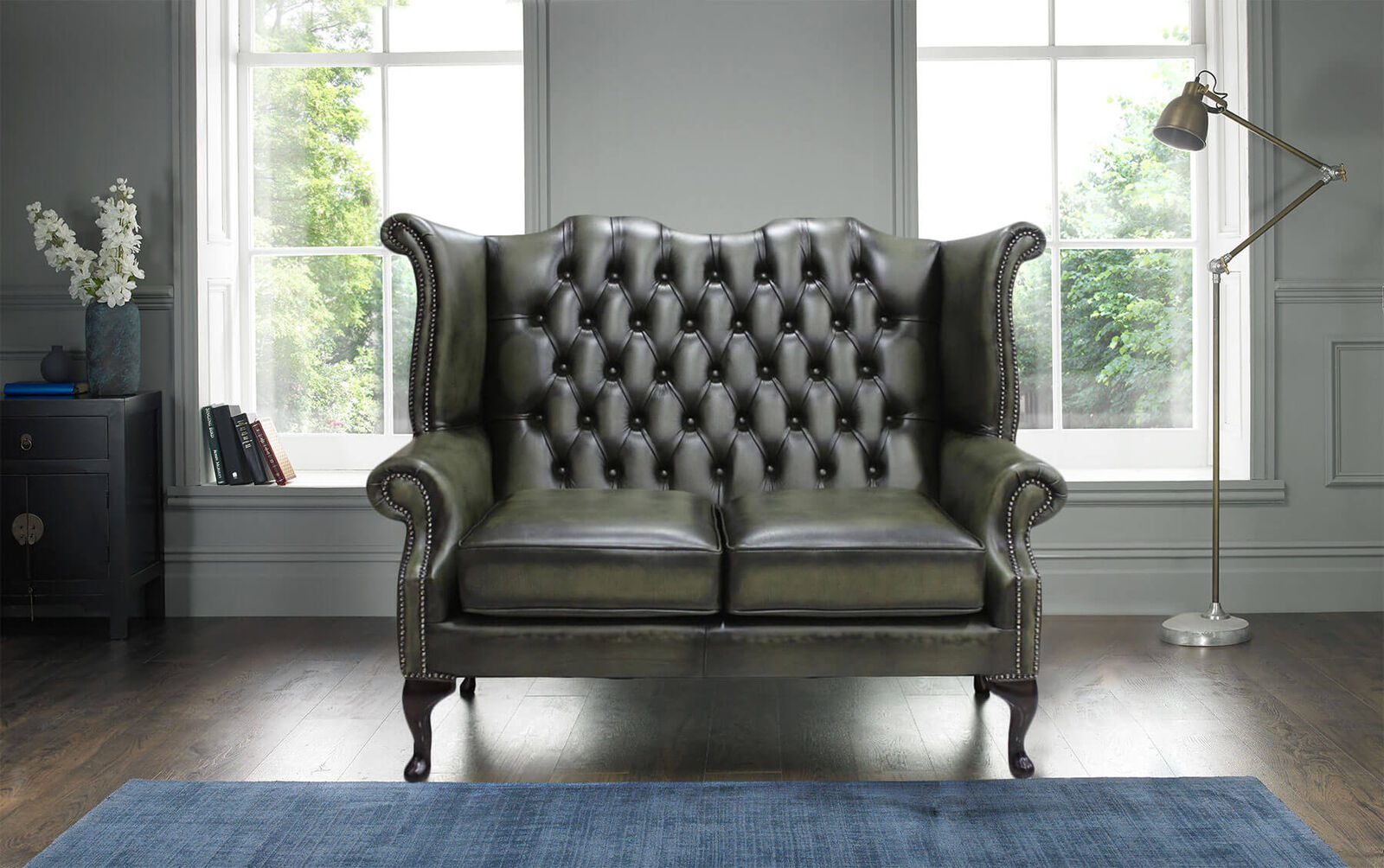 Product photograph of Chesterfield 2 Seater Queen Anne High Back Wing Sofa Antique Olive Leather from Designer Sofas 4U