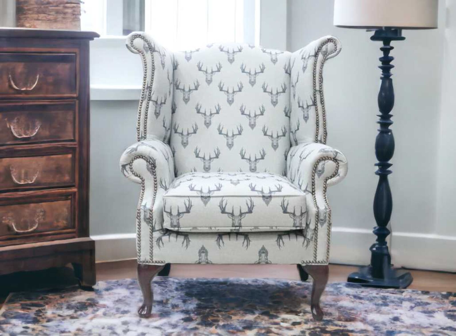 Product photograph of Chesterfield Queen Anne High Back Wing Chair Stag Head Fabric from Designer Sofas 4U