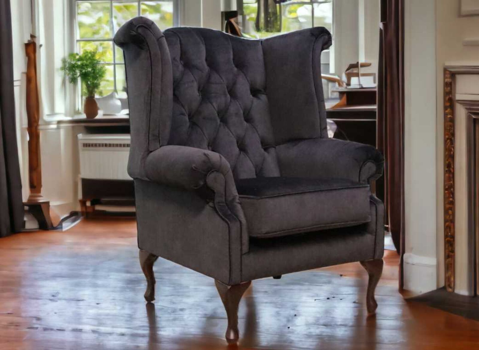 Product photograph of Chesterfield Thomas Queen Anne High Back Wing Chair Odyssey Black Velvet from Designer Sofas 4U