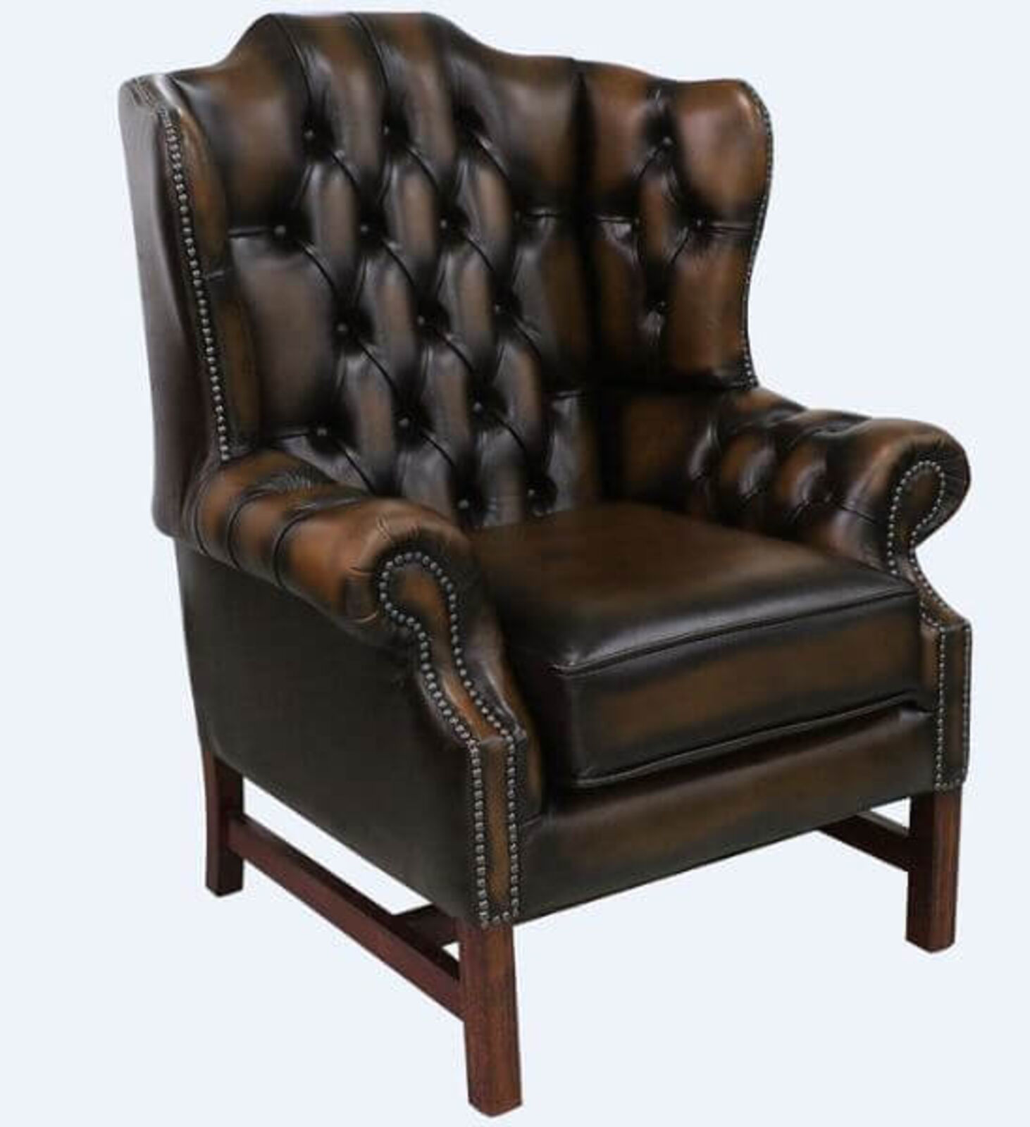 Product photograph of Chesterfield Churchill High Back Wing Chair Cushioned Seat Antique Tan Leather from Designer Sofas 4U