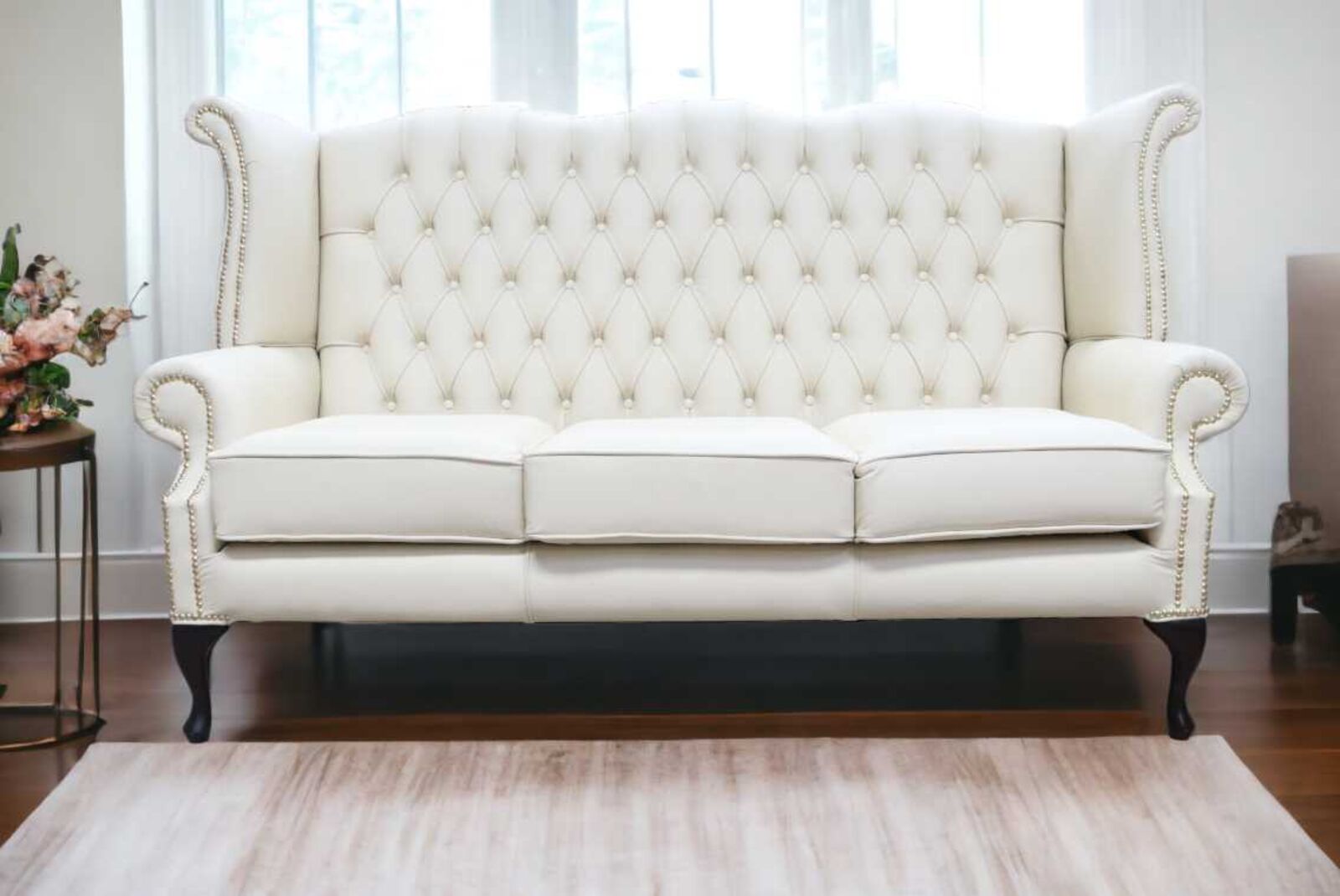 Product photograph of Chesterfield 3 Seater Queen Anne High Back Wing Sofa Cottonseed Cream Leather from Designer Sofas 4U