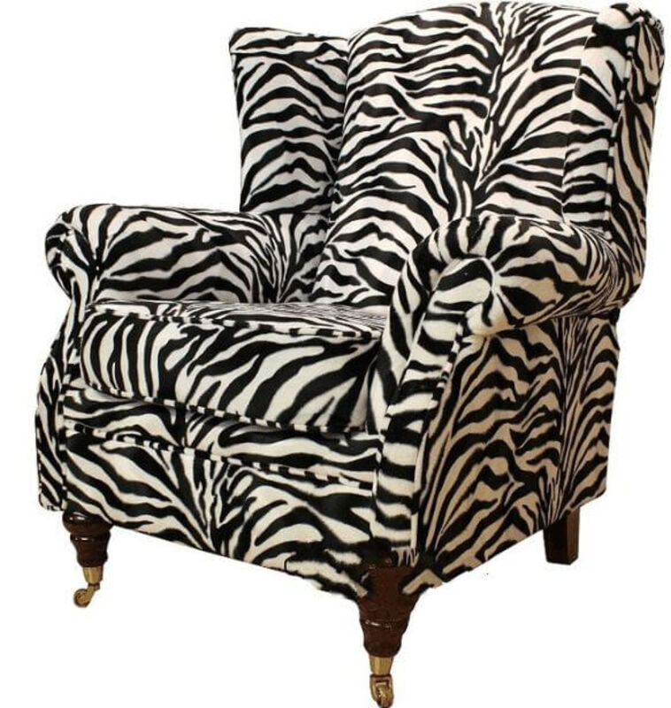 Product photograph of Wing Chair Fireside High Back Armchair Zebra Animal Print Fabric from Designer Sofas 4U